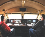 A two-person crew operates a freight train.