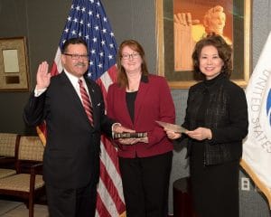 U.S. Secretary of Transportation Elaine L. Chao swears in Raymond P. Martinez as administrator of the Federal Motor Carriers Safety Administration. From left are Martinez, Martinez's wife, Marin Gibson, and Chao. (PRNewsfoto via Federal Motor Carrier Safety Administration)