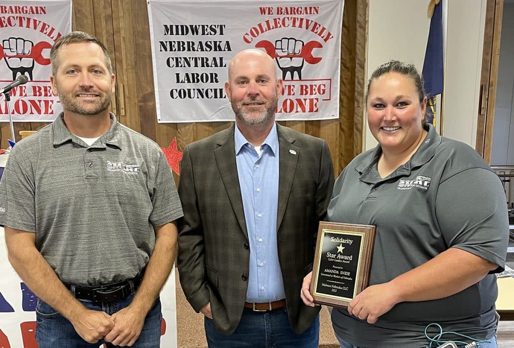 SMART TD GO-953 General Chairperson Luke Edington, Nebraska State Legislative Director Andy Foust and Local 200 Chairperson Manda Snide have their picture taken at the Midwest Nebraska Central Labor Council's Solidarity Day.