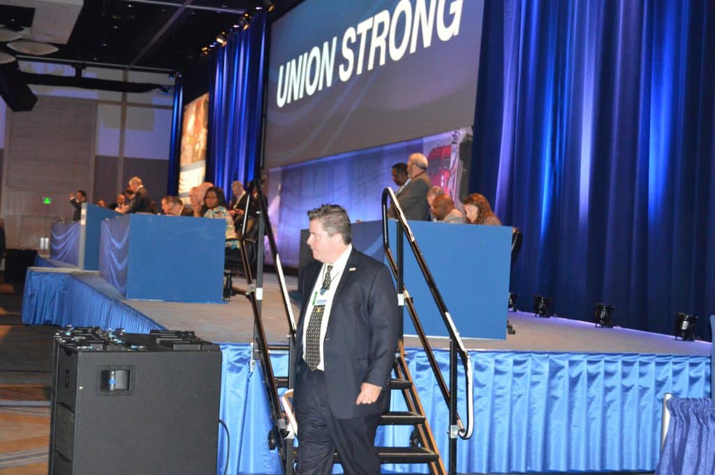 Staff member Dan Lough works at the 2014 SMART Transportation Division Convention.