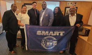 Bus Department Vice President James Sandoval and General Chairperson Anthony Petty stand with the rest of the SMART-TD negotiating team.