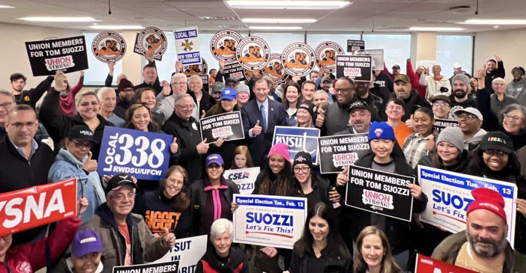 U.S. House District 3 candidate Tom Suozzi poses with union members in this photo courtesy the New York State AFL-CIO Twitter account.