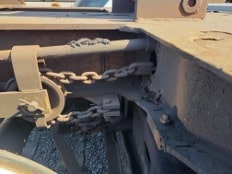 View of linkage binding on car.