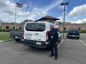 Local 33 retiree James Chester, whose pension was restored by the American Rescue Plan, stands next to his van at the Local 33 union hall.